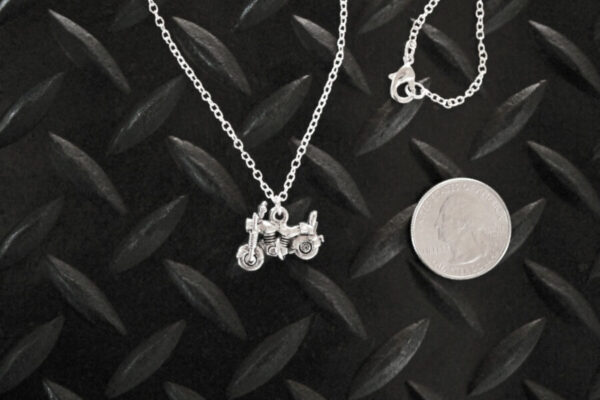 Little Silver Motorcycle Necklace with quarter for scale
